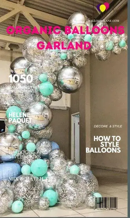 A vibrant garland of organic balloons displayed on a magazine cover, showcasing a festive and eco-friendly theme.